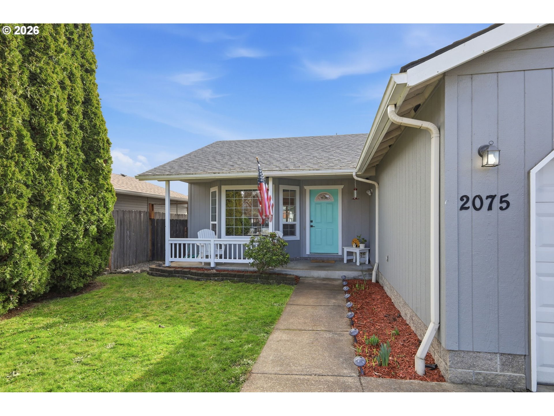 2075 Bryant Avenue Cottage Grove, OR 97424 - Photo 2 of 29 a front view of a house with a yard