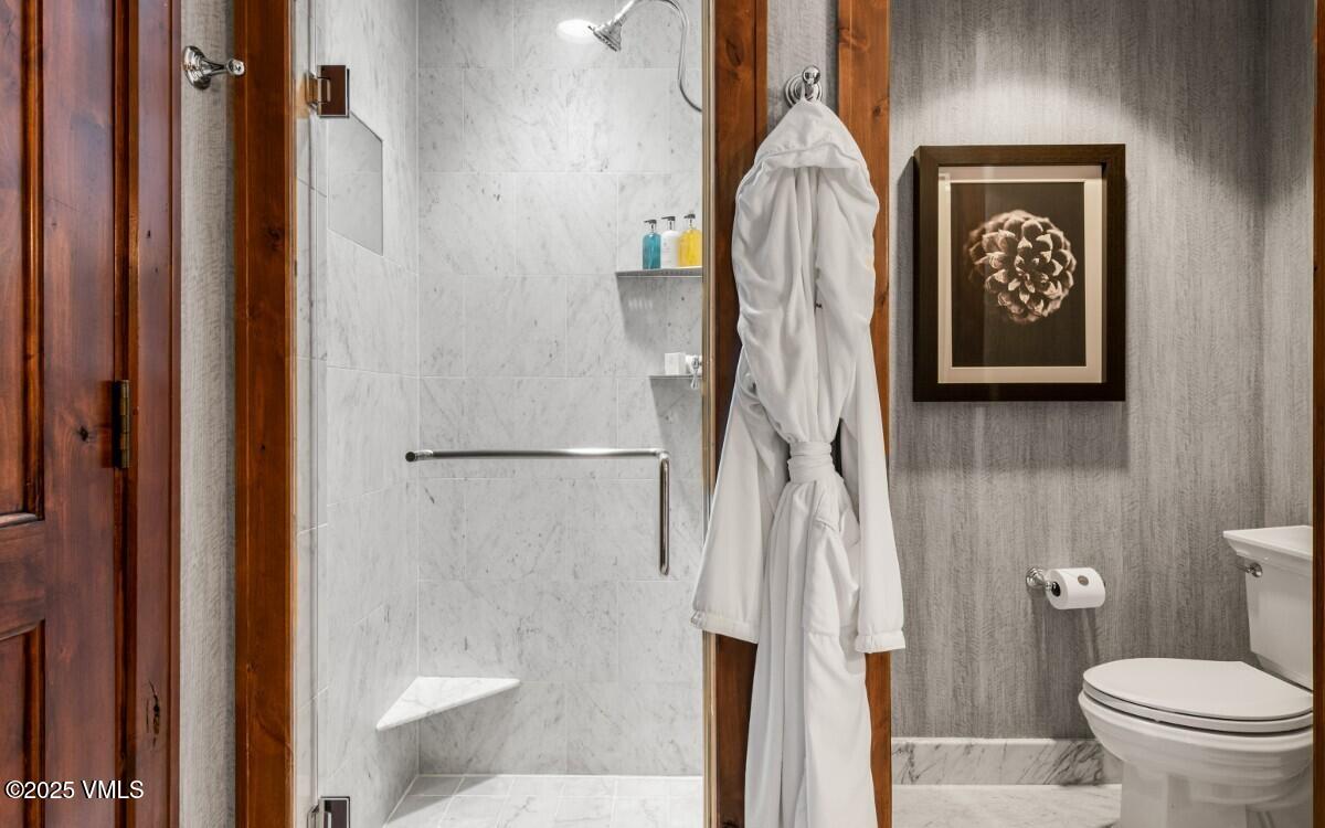 100 Bachelor Ridge Road, Unit 3508/09 Avon, CO 81620 - Photo 11 of 33 a bathroom with a toilet a sink and vanity