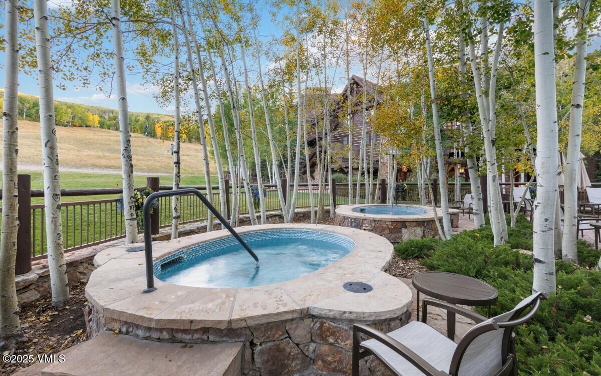 100 Bachelor Ridge Road, Unit 3508/09 Avon, CO 81620 - Photo 30 of 33 a view of a swimming pool with chairs