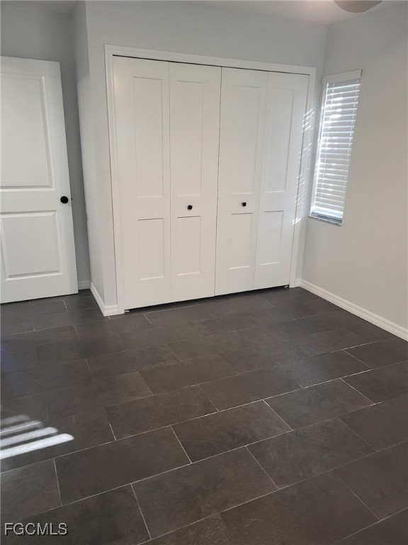 5028 Chiquita Boulevard South, Unit 101 Cape Coral, FL 33914 - Photo 3 of 7 a view of an empty room with a window