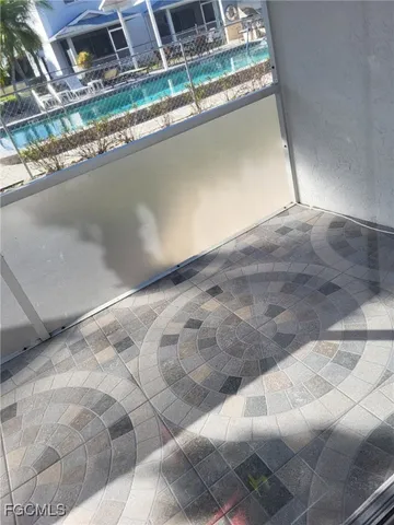 a view of a swimming pool with outdoor seating