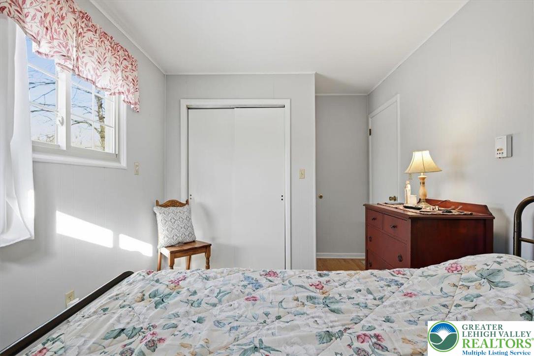 20 Pool Drive Jim Thorpe, PA 18229 - Photo 16 of 44 a bedroom with a bed and wooden floor