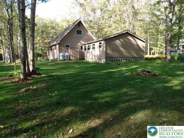 a view of a back yard of the house