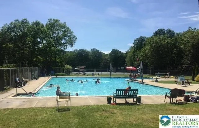 a view of swimming pool with chairs