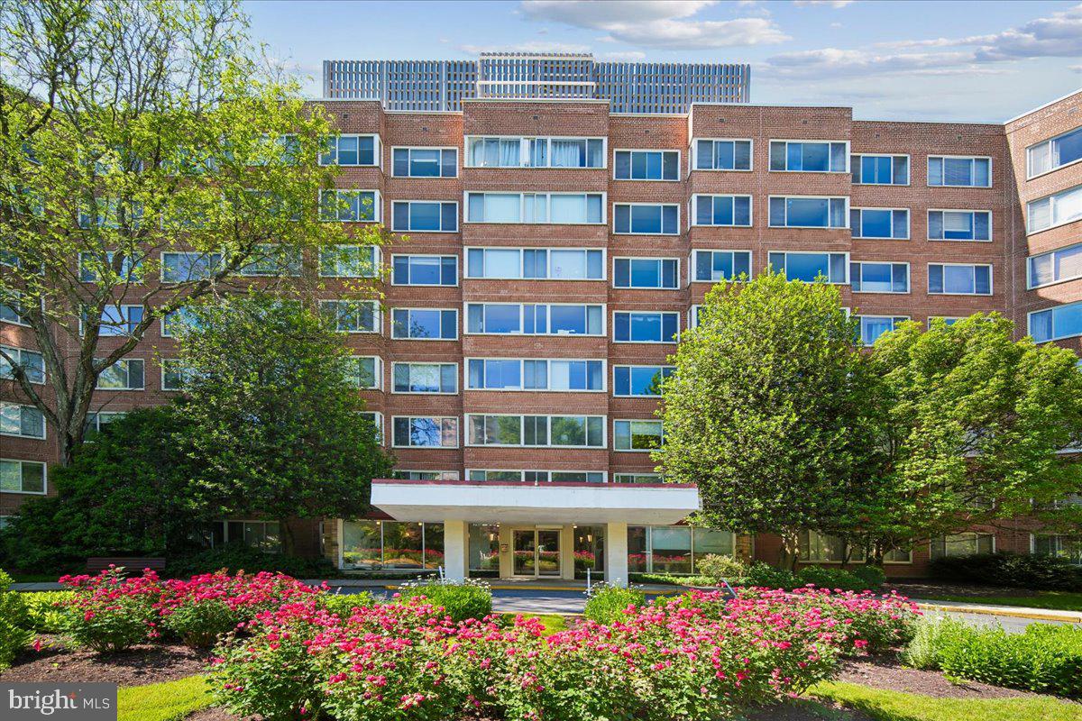 4000 Tunlaw Road Northwest, Unit 1003 Washington, DC 20007 - Photo 1 of 25 Charming brick facade with vibrant blooms.