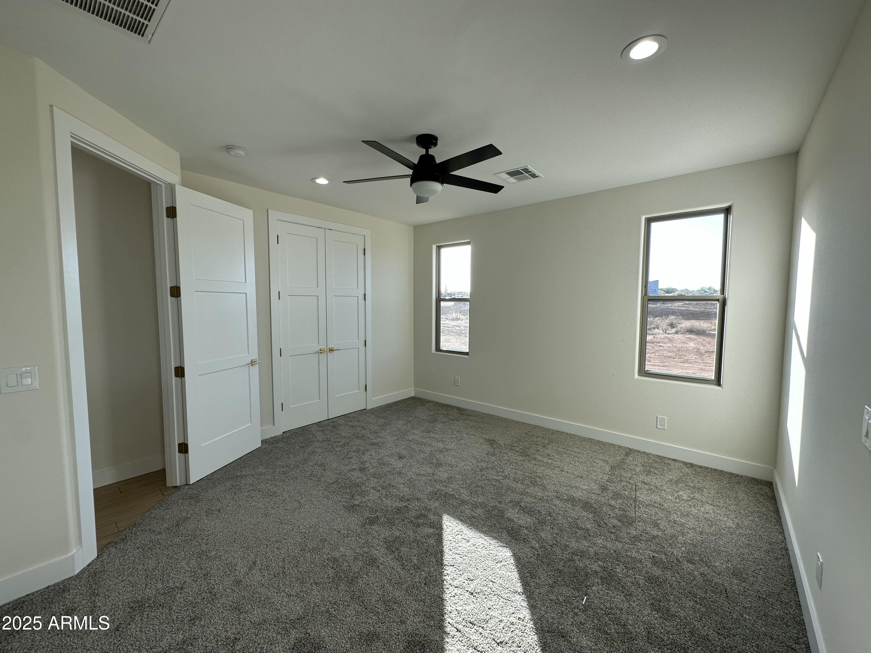 5749 North Nigal Road Casa Grande, AZ 85194 - Photo 12 of 15 a view of a livingroom with a chandelier fan