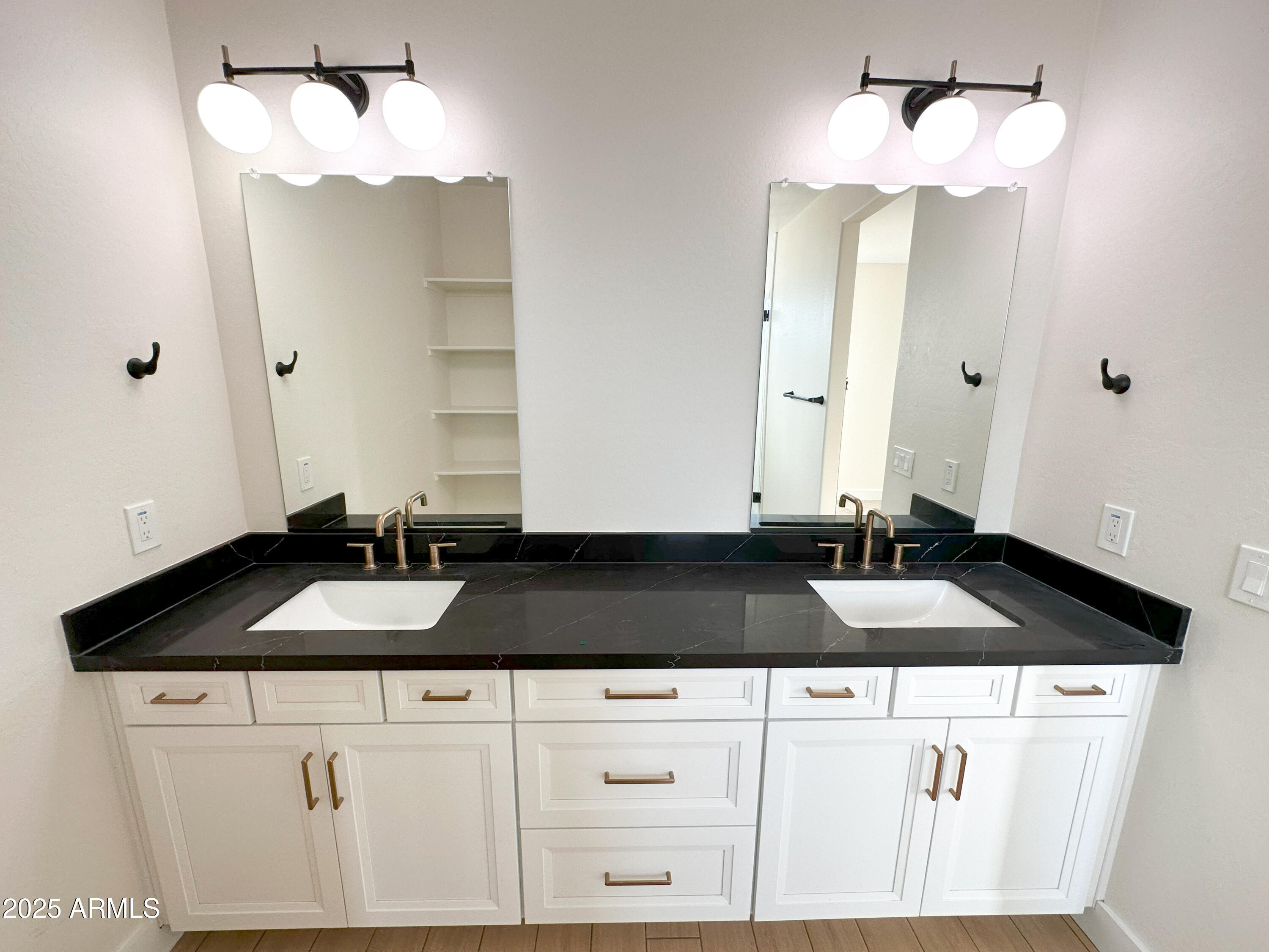 5749 North Nigal Road Casa Grande, AZ 85194 - Photo 5 of 15 a bathroom with a granite countertop sink and a mirror
