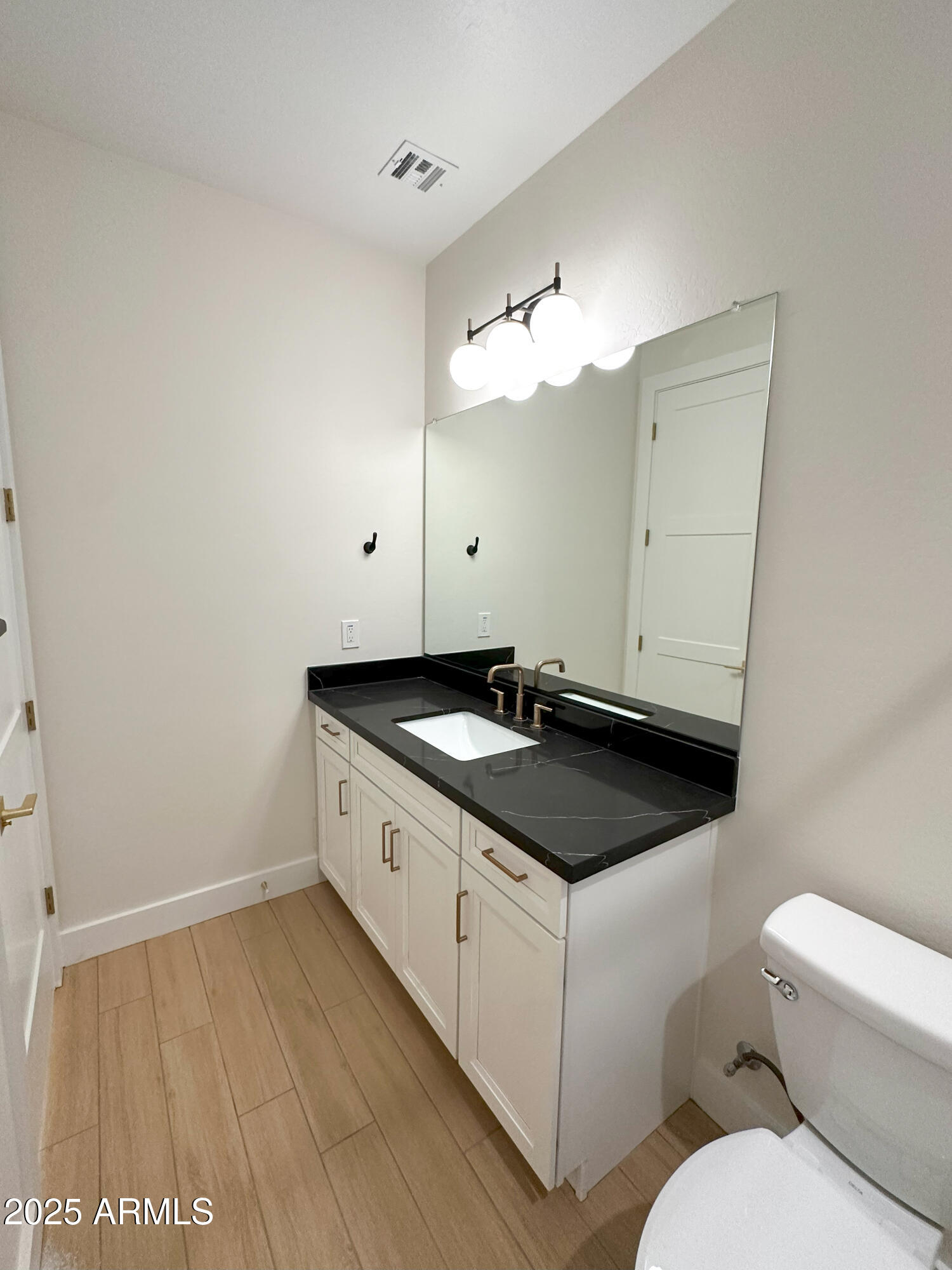 5749 North Nigal Road Casa Grande, AZ 85194 - Photo 7 of 15 a bathroom with a sink and a mirror