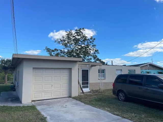 a view of a car in front of a house