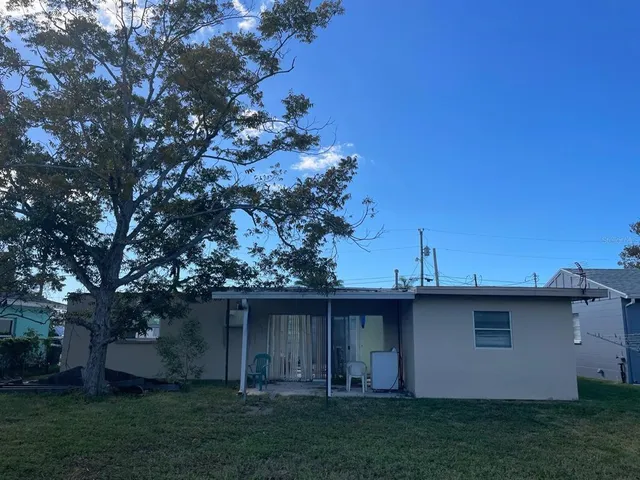 a backyard of a house with lots of green space