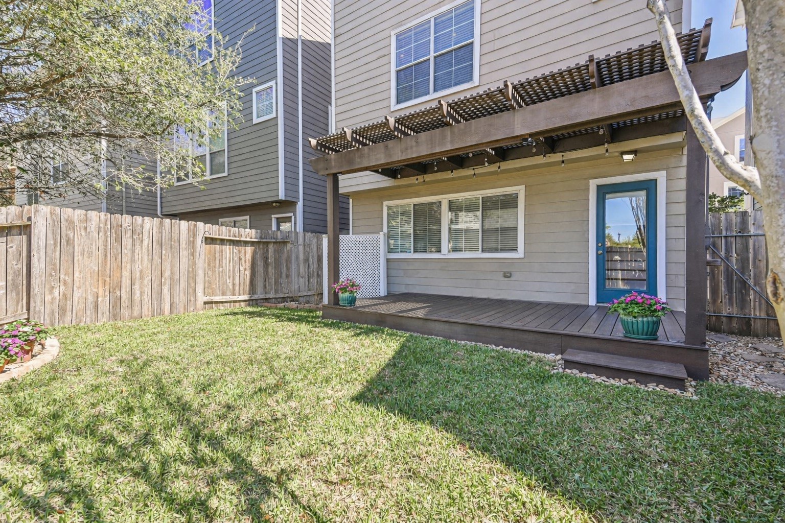 3208 Clearview Circle Houston, TX 77025 - Photo 28 of 30 The decking and the pergola create a comfortable outdoor space, while the yard still offers room to enjoy.
