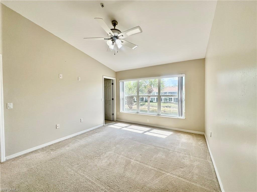 996 Hampton Circle, Unit 71 Naples, FL 34105 - Photo 11 of 30 a view of an empty room with a window
