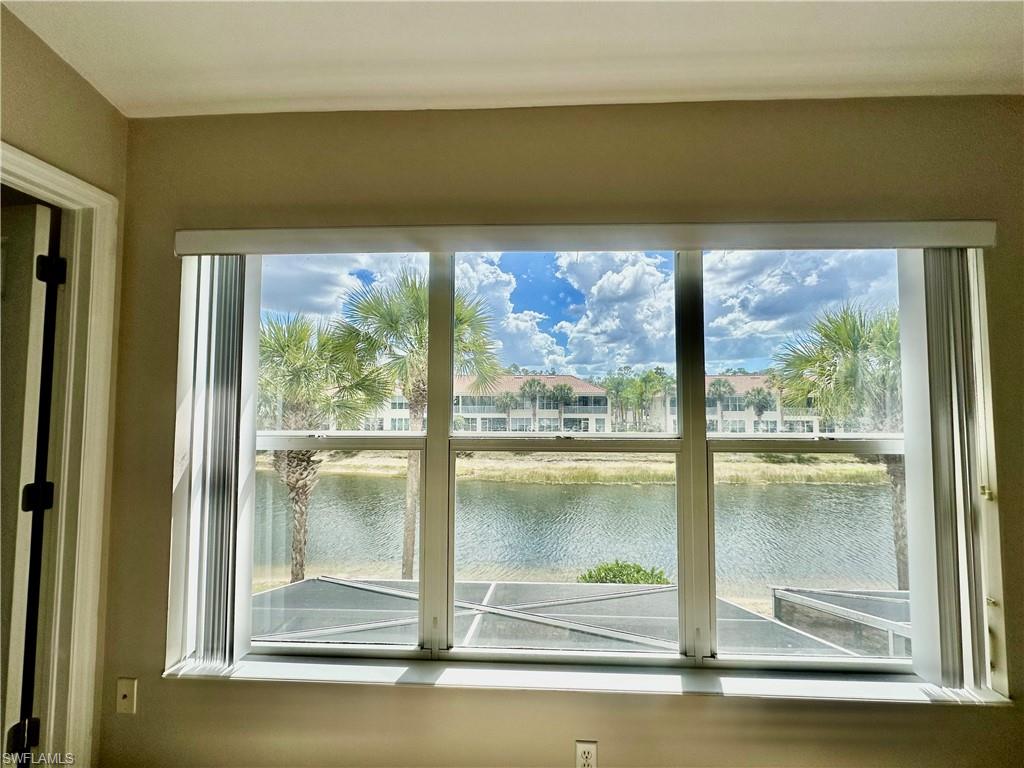 996 Hampton Circle, Unit 71 Naples, FL 34105 - Photo 13 of 30 a view of a lake from a window