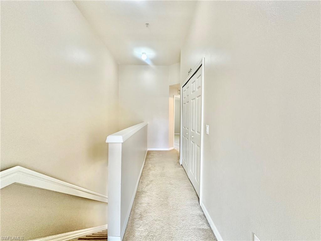 996 Hampton Circle, Unit 71 Naples, FL 34105 - Photo 15 of 30 a view of hallway with stairs