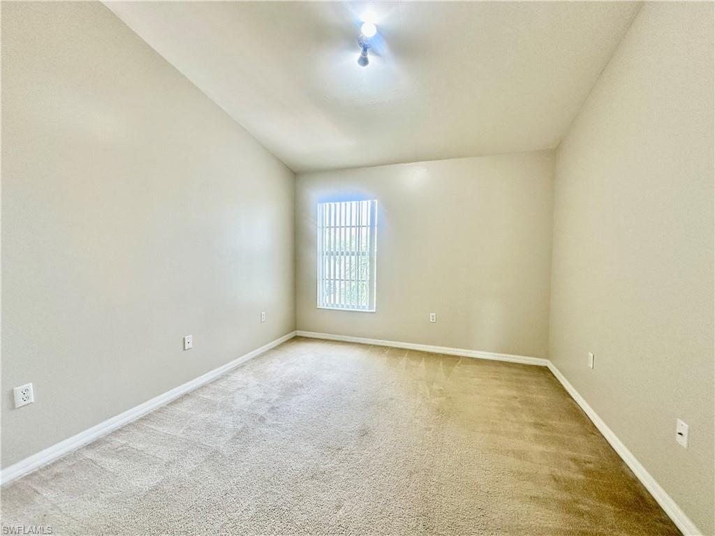 996 Hampton Circle, Unit 71 Naples, FL 34105 - Photo 16 of 30 an empty room with windows