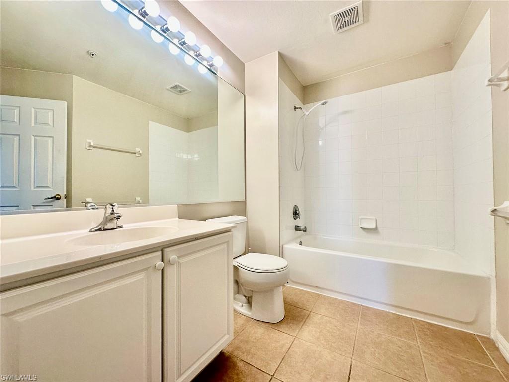 996 Hampton Circle, Unit 71 Naples, FL 34105 - Photo 18 of 30 a bathroom with a sink a toilet and a bathtub
