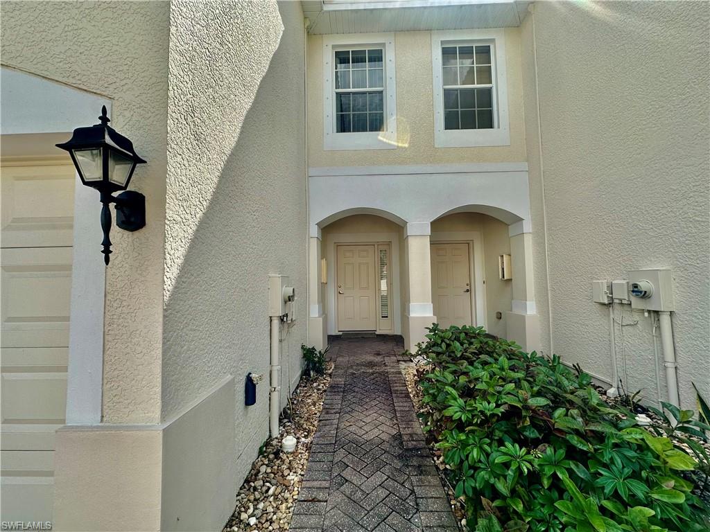996 Hampton Circle, Unit 71 Naples, FL 34105 - Photo 2 of 30 a view of front door of house