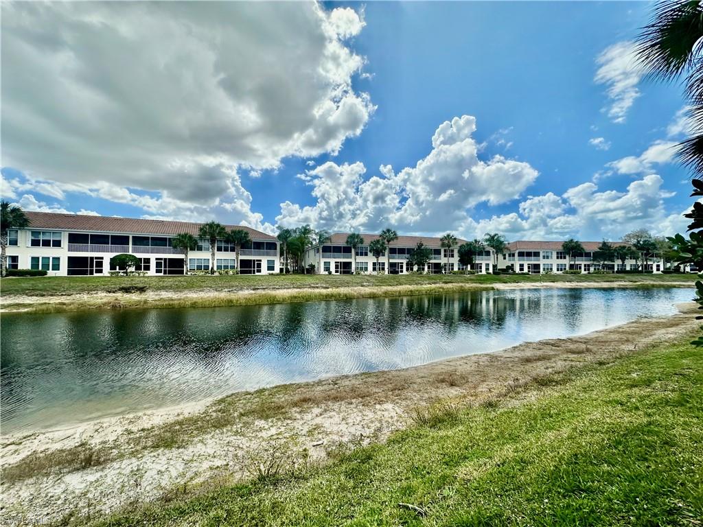 996 Hampton Circle, Unit 71 Naples, FL 34105 - Photo 22 of 30 an aerial view of a house with a lake view