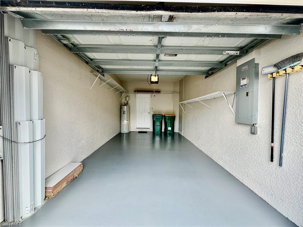 996 Hampton Circle, Unit 71 Naples, FL 34105 - Photo 24 of 30 a view of a hallway with stairs