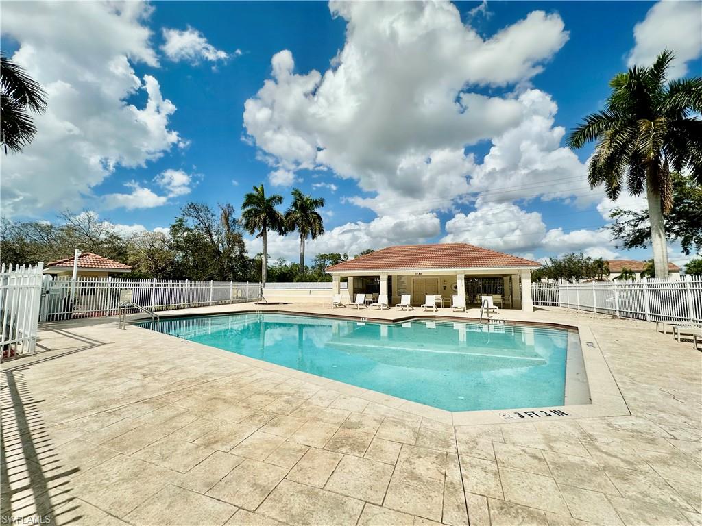 996 Hampton Circle, Unit 71 Naples, FL 34105 - Photo 26 of 30 a view of a house with a yard