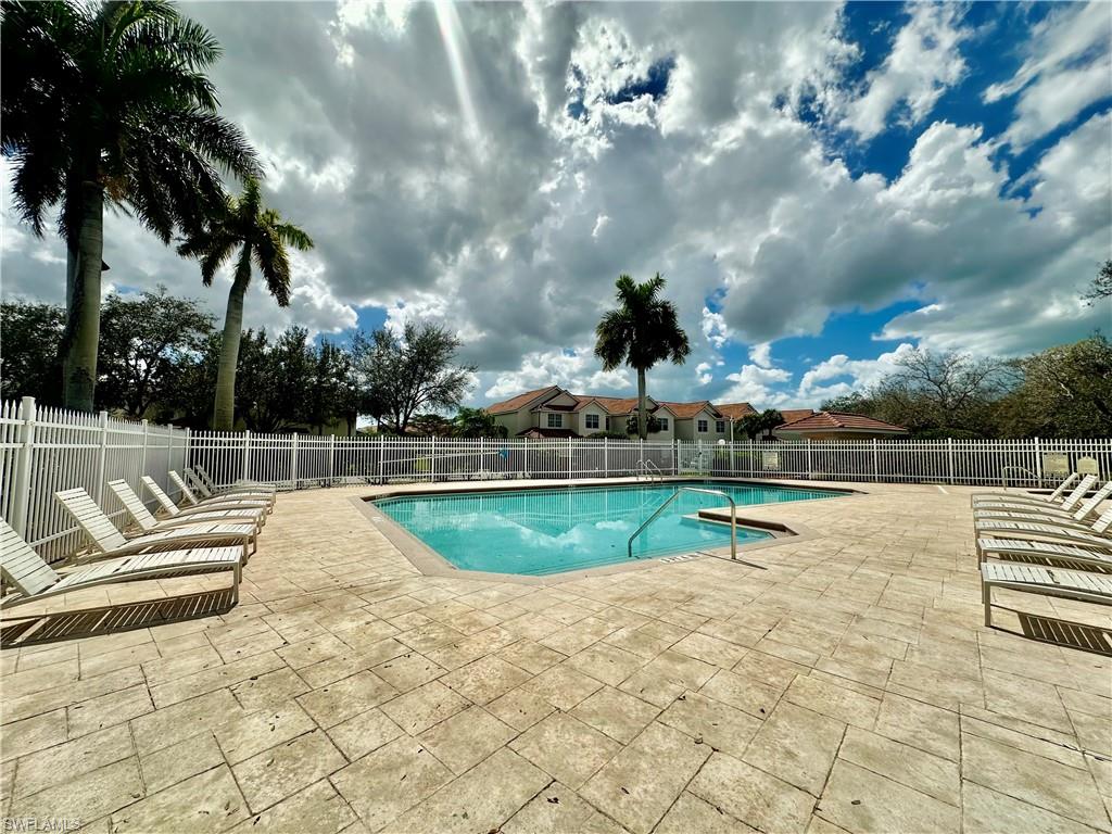 996 Hampton Circle, Unit 71 Naples, FL 34105 - Photo 27 of 30 a view of swimming pool with seating space