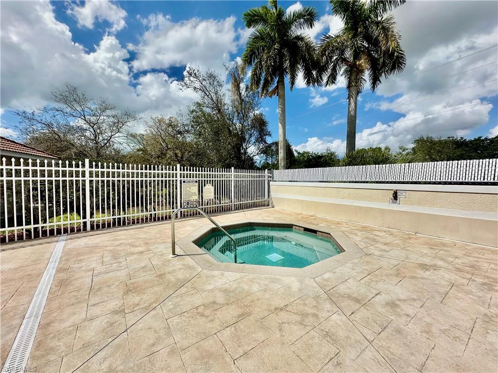 996 Hampton Circle, Unit 71 Naples, FL 34105 - Photo 29 of 30 a view of outdoor space with swimming pool