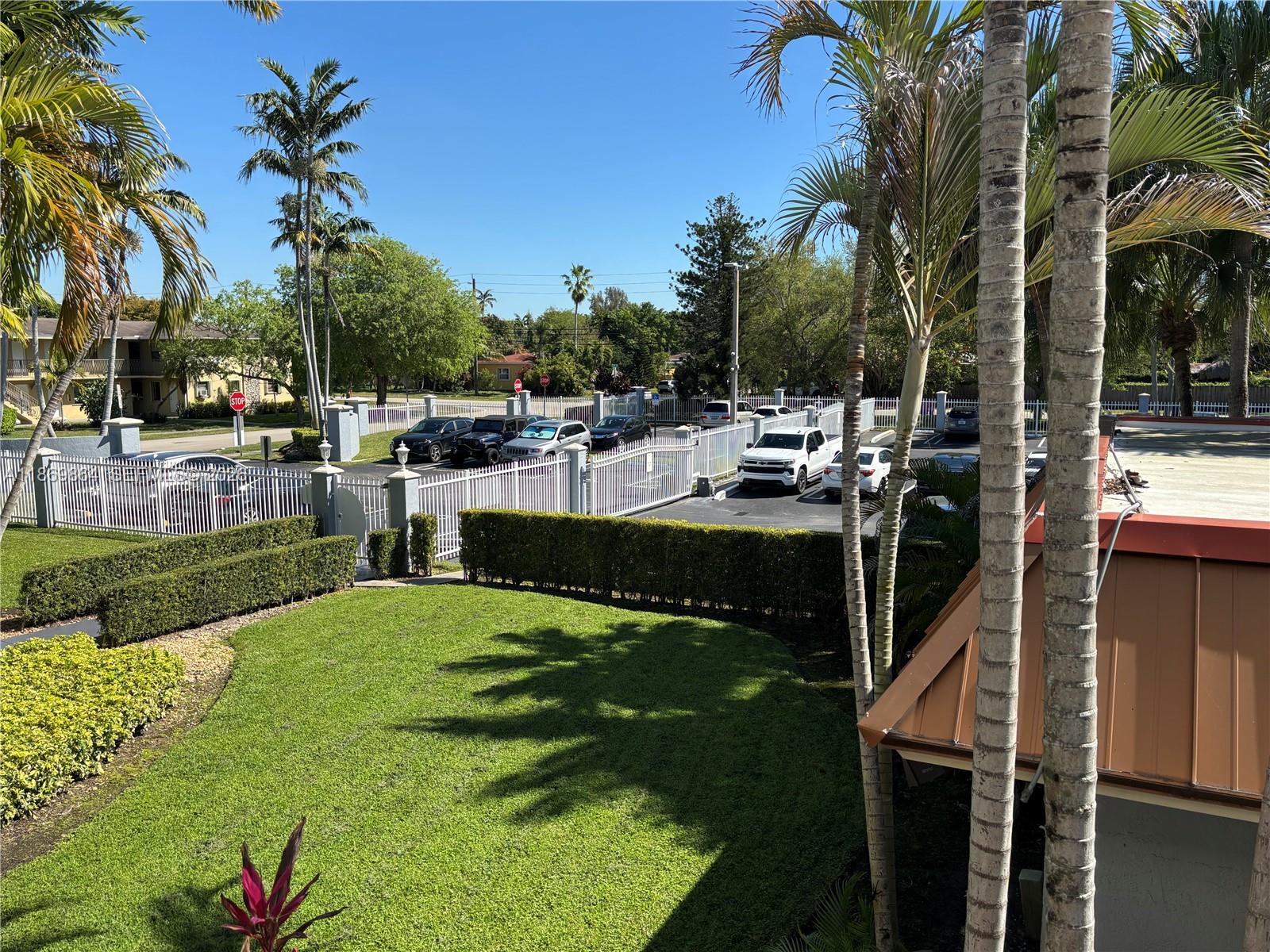 4600 Southwest 67th Avenue, Unit 212 Miami, FL 33155 - Photo 18 of 23 a view of a house with backyard and sitting area