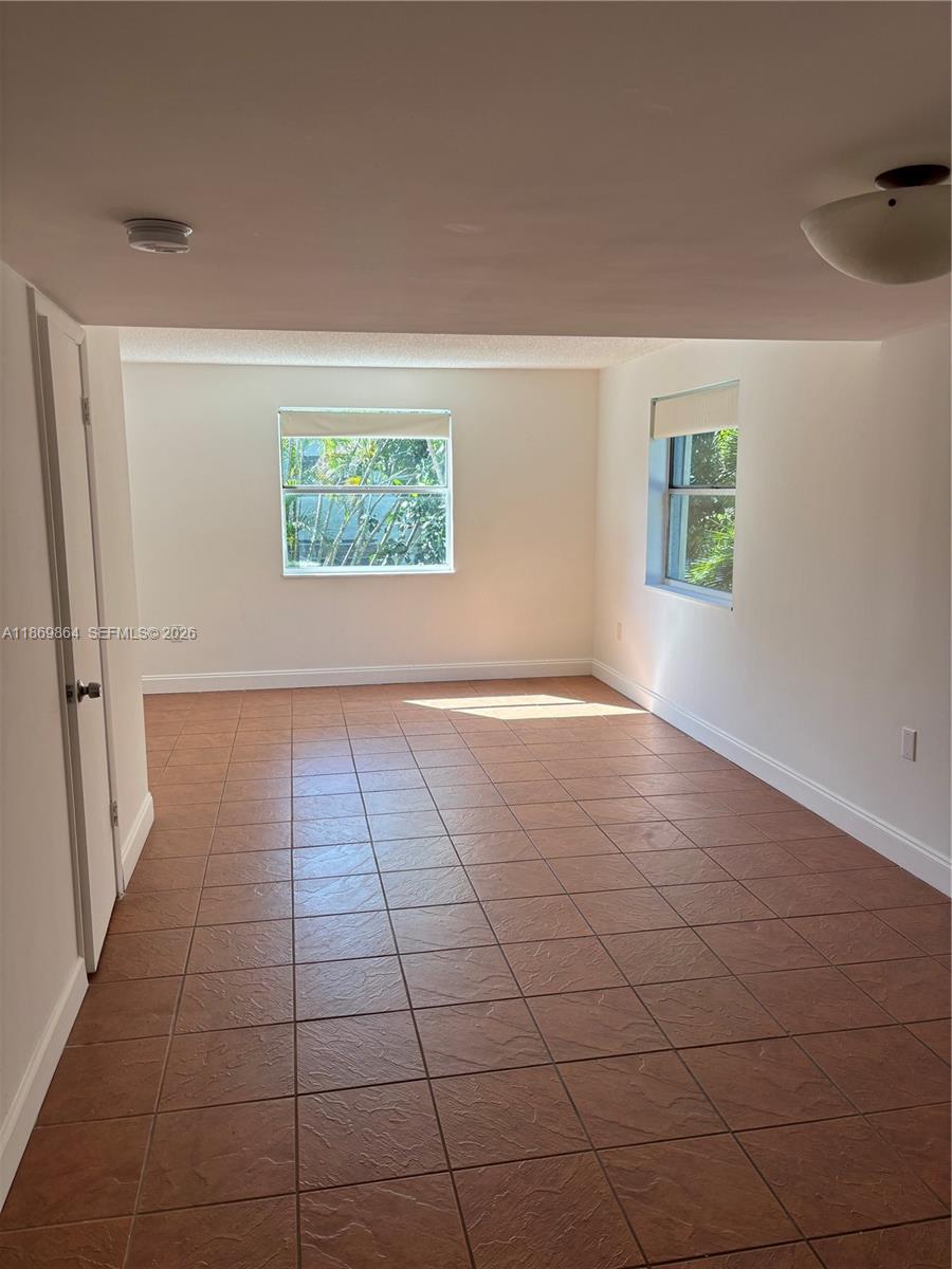 4600 Southwest 67th Avenue, Unit 212 Miami, FL 33155 - Photo 6 of 23 an empty room with windows
