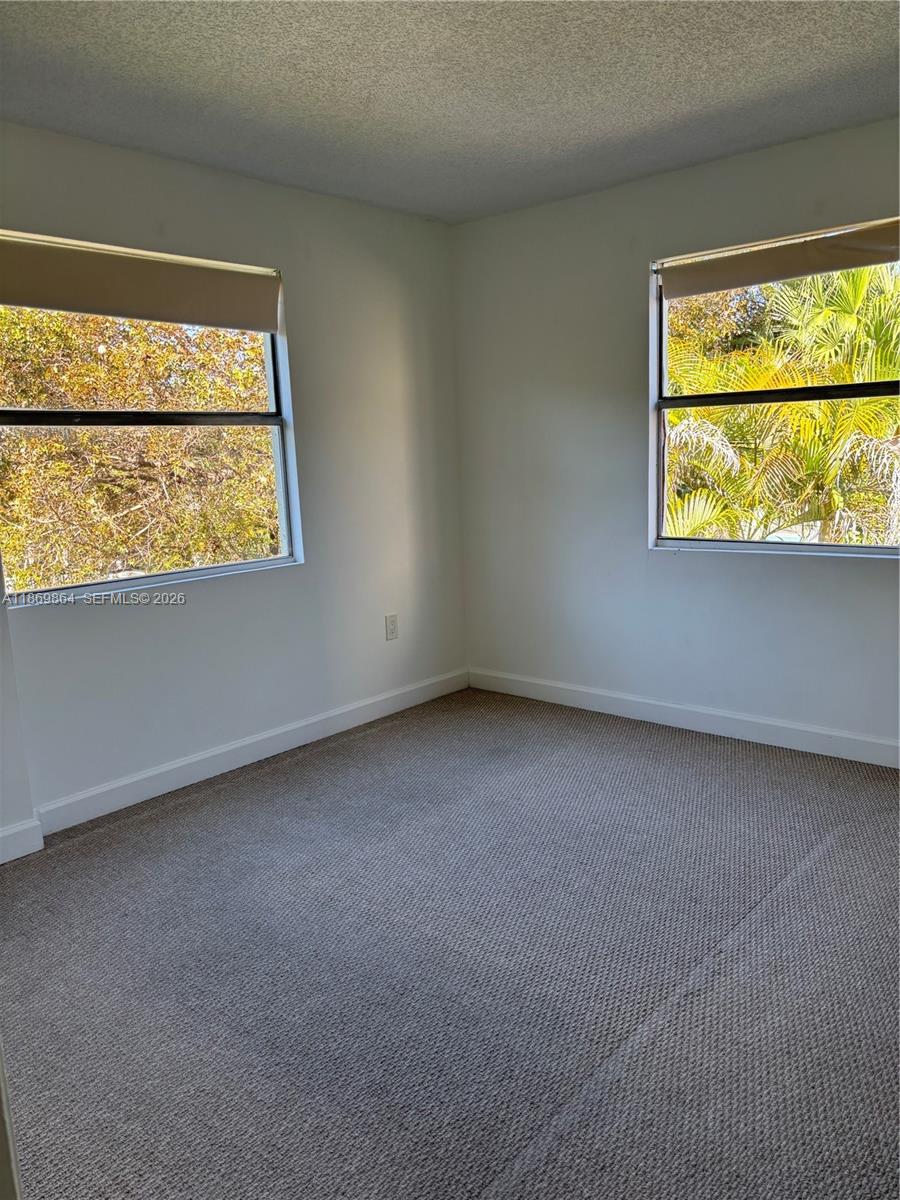 4600 Southwest 67th Avenue, Unit 212 Miami, FL 33155 - Photo 7 of 23 an empty room with a window