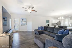 a living room with furniture and a flat screen tv