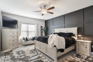 113 Ridgeway Circle Crestview, FL 32536 - Photo 22 of 55 a bedroom with furniture and a flat screen tv