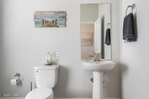 113 Ridgeway Circle Crestview, FL 32536 - Photo 25 of 55 a bathroom with a toilet sink and mirror