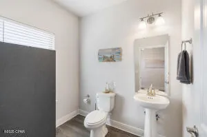 a vase with white flowers sitting on a table