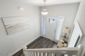 a living room with furniture and a painting on the wall
