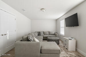 113 Ridgeway Circle Crestview, FL 32536 - Photo 34 of 55 a living room with furniture and a flat screen tv