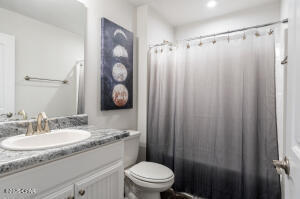 113 Ridgeway Circle Crestview, FL 32536 - Photo 39 of 55 a bathroom with a granite countertop sink toilet and shower