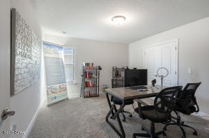 113 Ridgeway Circle Crestview, FL 32536 - Photo 40 of 55 a view of a workspace with furniture and a window