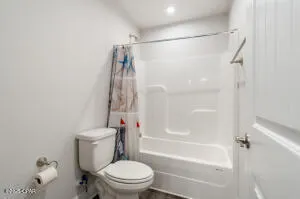 a view of a porch with furniture and a yard