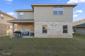 113 Ridgeway Circle Crestview, FL 32536 - Photo 50 of 55 a backyard of a house with table and chairs