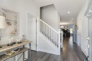 a view of hall way with furniture