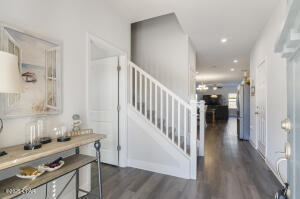 113 Ridgeway Circle Crestview, FL 32536 - Photo 6 of 55 a view of a hallway with wooden floor and staircase