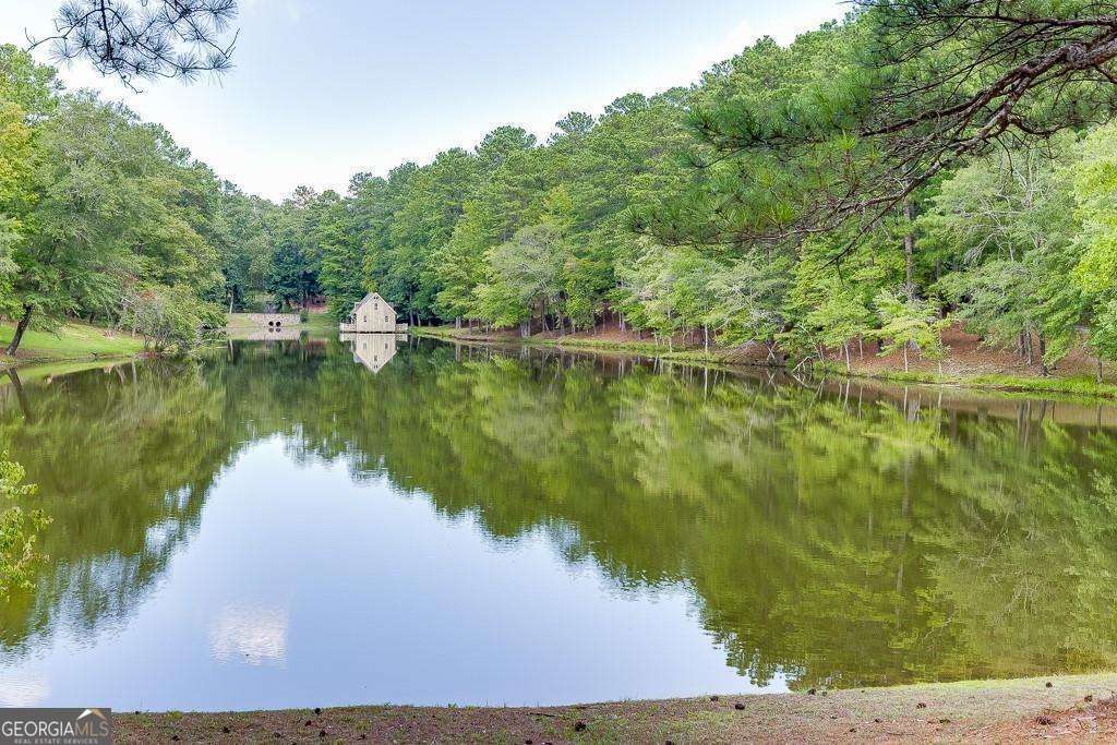 5755 Kennedy Road Buford, GA 30024 - Photo 11 of 23 a view of a lake view with a large trees