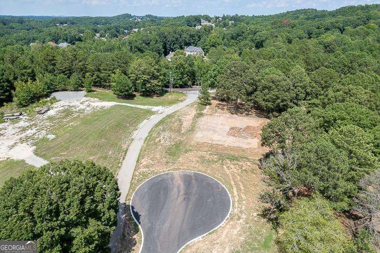 5755 Kennedy Road Buford, GA 30024 - Photo 15 of 23 an aerial view of a house with a yard