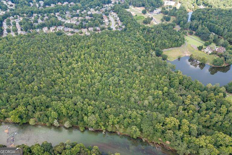 5755 Kennedy Road Buford, GA 30024 - Photo 18 of 23 an aerial view of a houses with yard