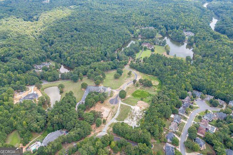 5755 Kennedy Road Buford, GA 30024 - Photo 22 of 23 an aerial view of residential house with outdoor space and lake view