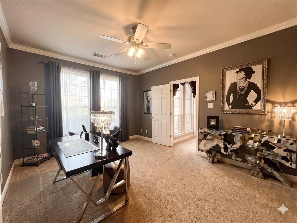 1919 Kings Pass Heath, TX 75032 - Photo 25 of 38 This versatile room features warm-toned walls, crown molding, and two windows with elegant drapery