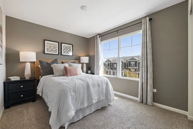 a bed room with a bed and a window