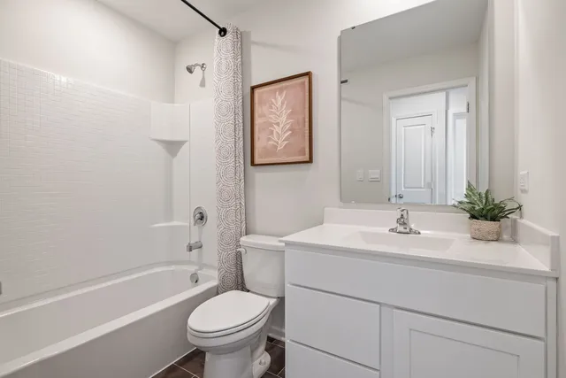 a bathroom with a sink a toilet and a bathtub