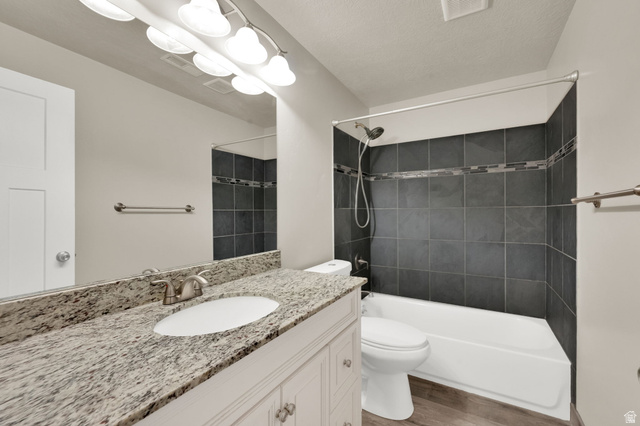 1857 Thunder Gulch Road Eagle Mountain, UT 84005 - Photo 33 of 50 Vanity with a light-toned countertop, under-mount sink, and brushed nickel faucet