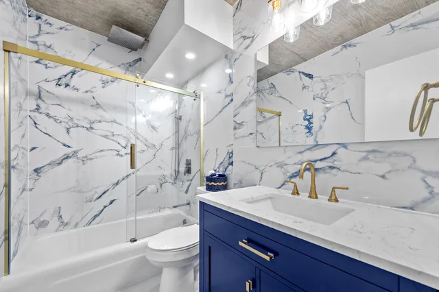 a bathroom with a sink a toilet and a bathtub